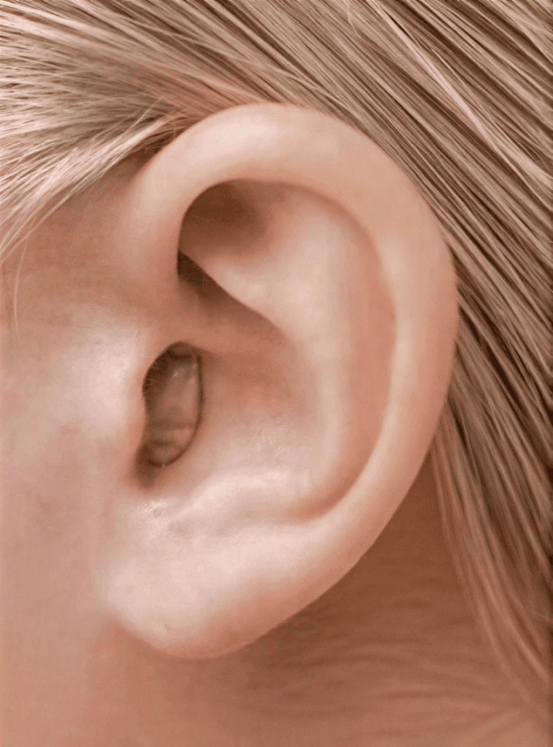 Ear with hearing aid close-up